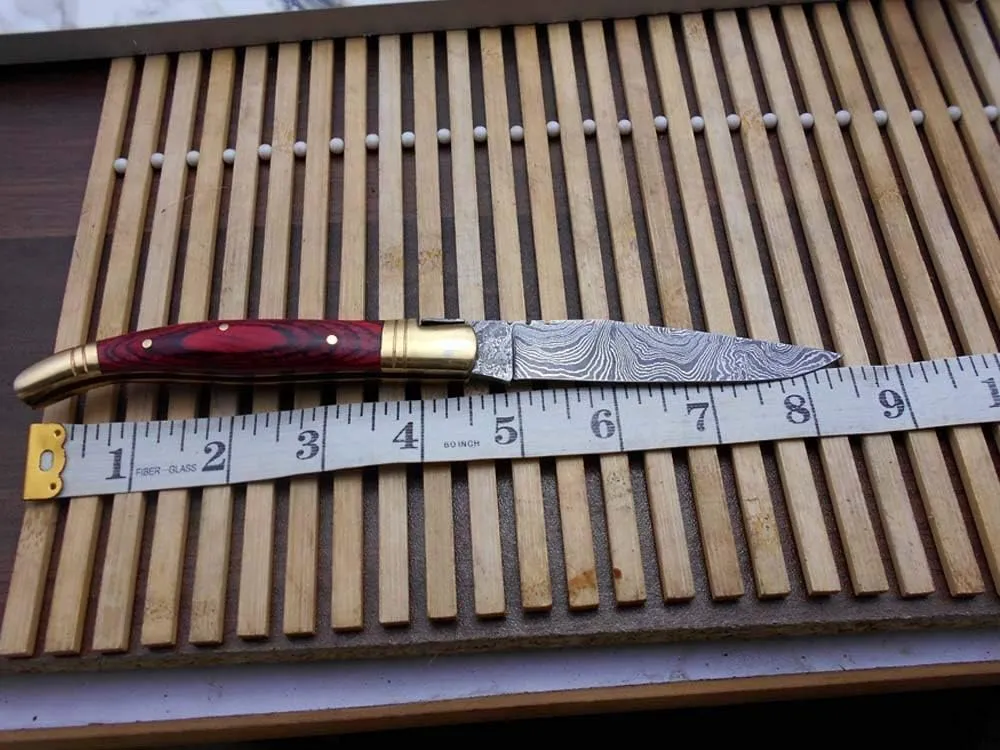 Real Damascus Steel Blade Laguiole Folding Knife Replica, 8.5" Long with 4" Hand Forged Custom Twist Pattern Blade. Red Dollar Wood & Brass Bolster Scale. Cow Hide Leather Sheath Included
